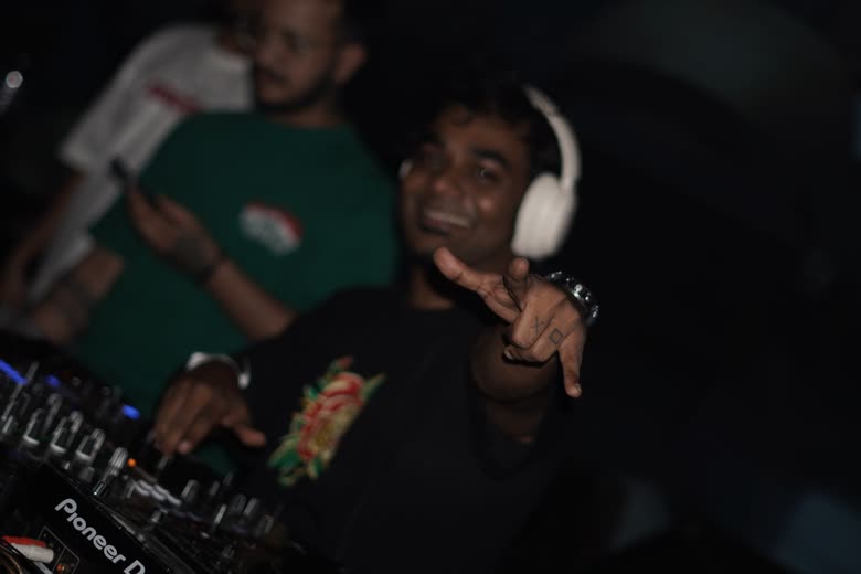Protonix smiling at the decks during a night set
